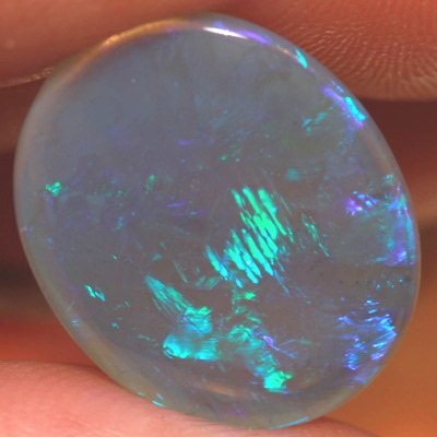 SOLID CRYSTAL OPAL Large opal 9cts! Peacock fire in alarge rolling flashes. Bright, clean colours. With VIDEO